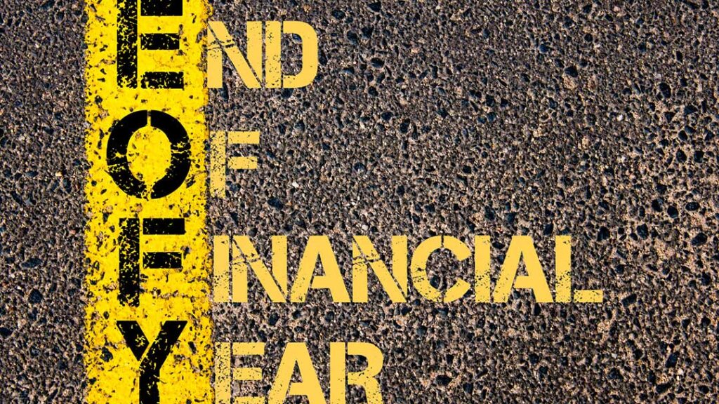 Yellow line on the road with the words end of financial year